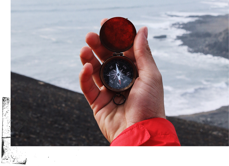 Hand holding compass